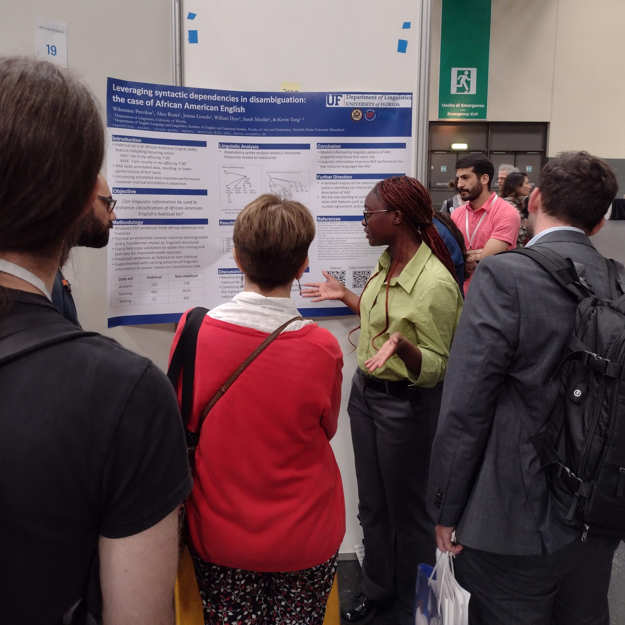 People standing around a presentation board